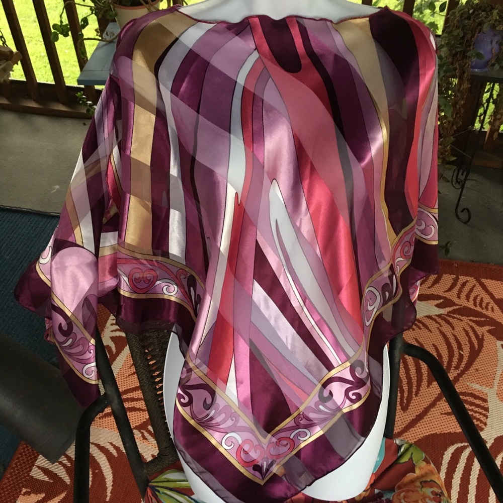 Silky poncho with peek-a-boo shoulders